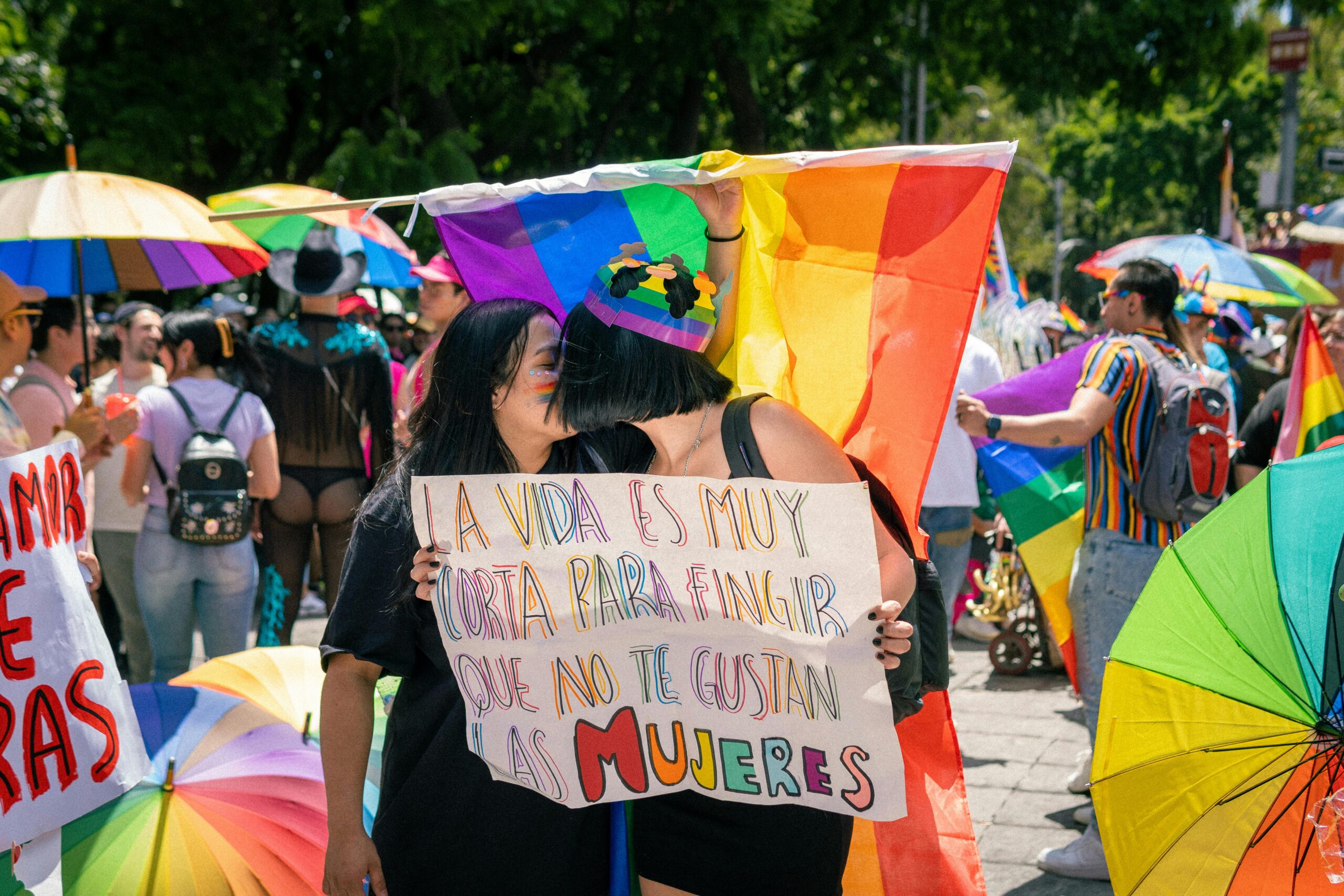 Colorful pride parade capturing joyful moments and LGBTQ+ solidarity in a sunny outdoor setting.