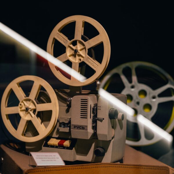 A vintage film projector displayed in a museum exhibit, capturing nostalgia.