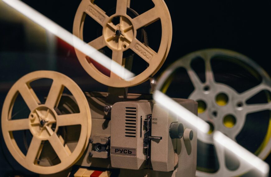 A vintage film projector displayed in a museum exhibit, capturing nostalgia.